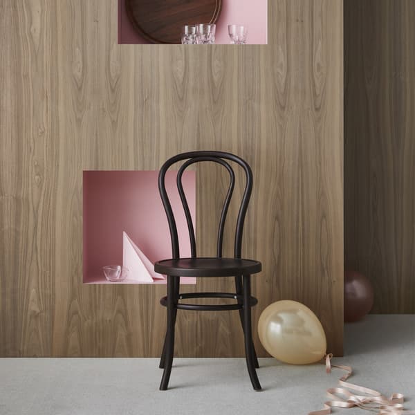 BJURÅN chair in black with balloons.