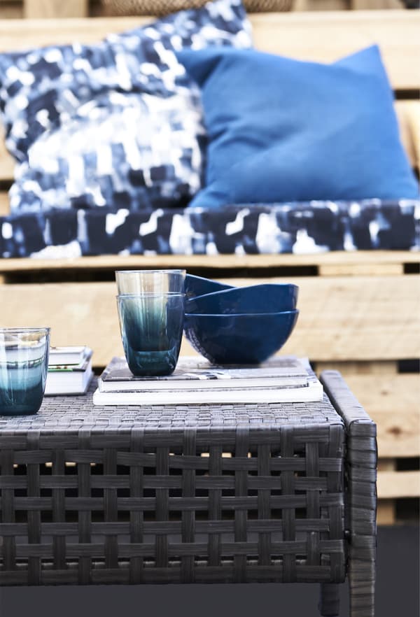 Blue bowls on a weatherproof table.
