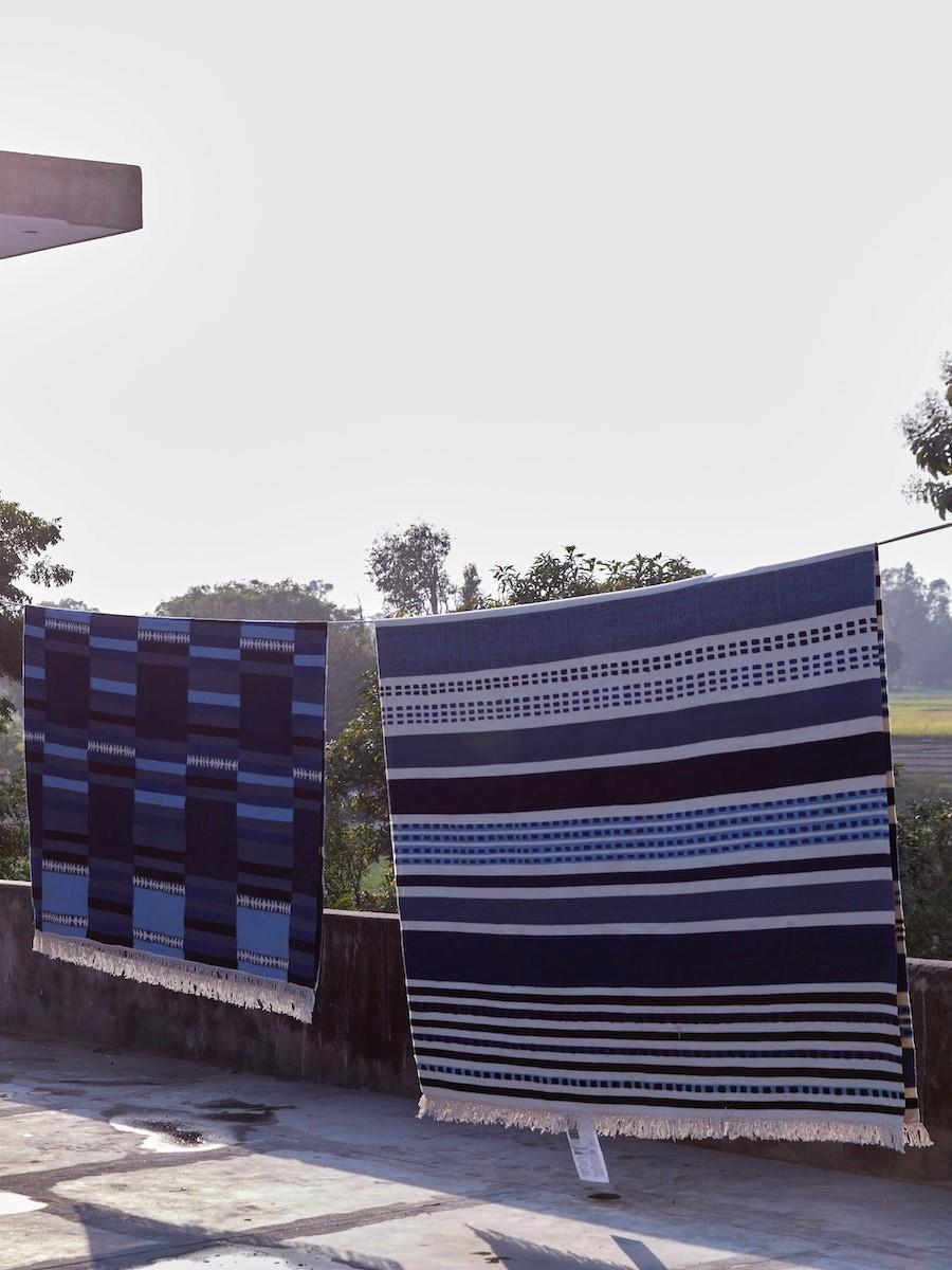 blue stripe rug on a laundry line