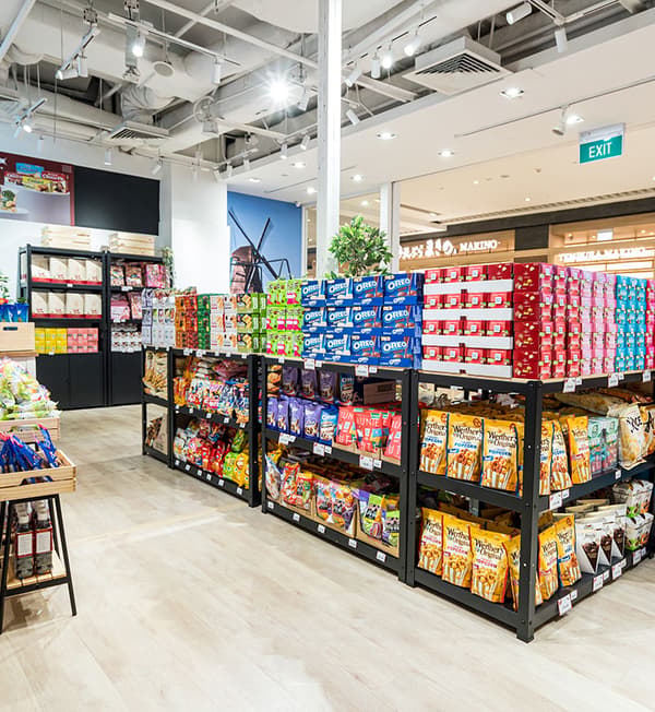 BROR work benches filled with products are displayed on birch flooring.