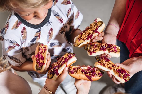 children grab their hotdog which is popular snack at IKEA Bistro