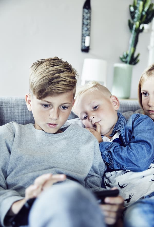 Children looking at a tablet.