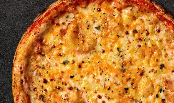Classic Margherita pizza topped with melted cheese and oregano.