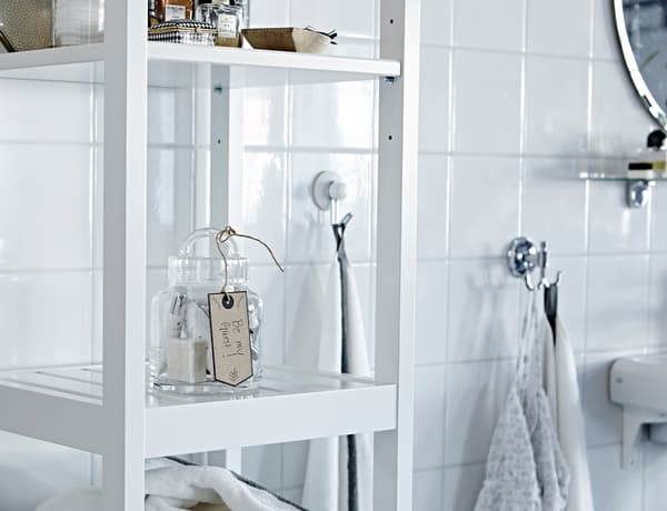 Clear off a bathroom shelf and hook so guests have a place to keep their toiletries. In case they forgot something, why not have a spare toothbrush or some shampoo?