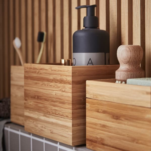 Close up angled image of DRAGAN set of bathroom boxes in bamboo.