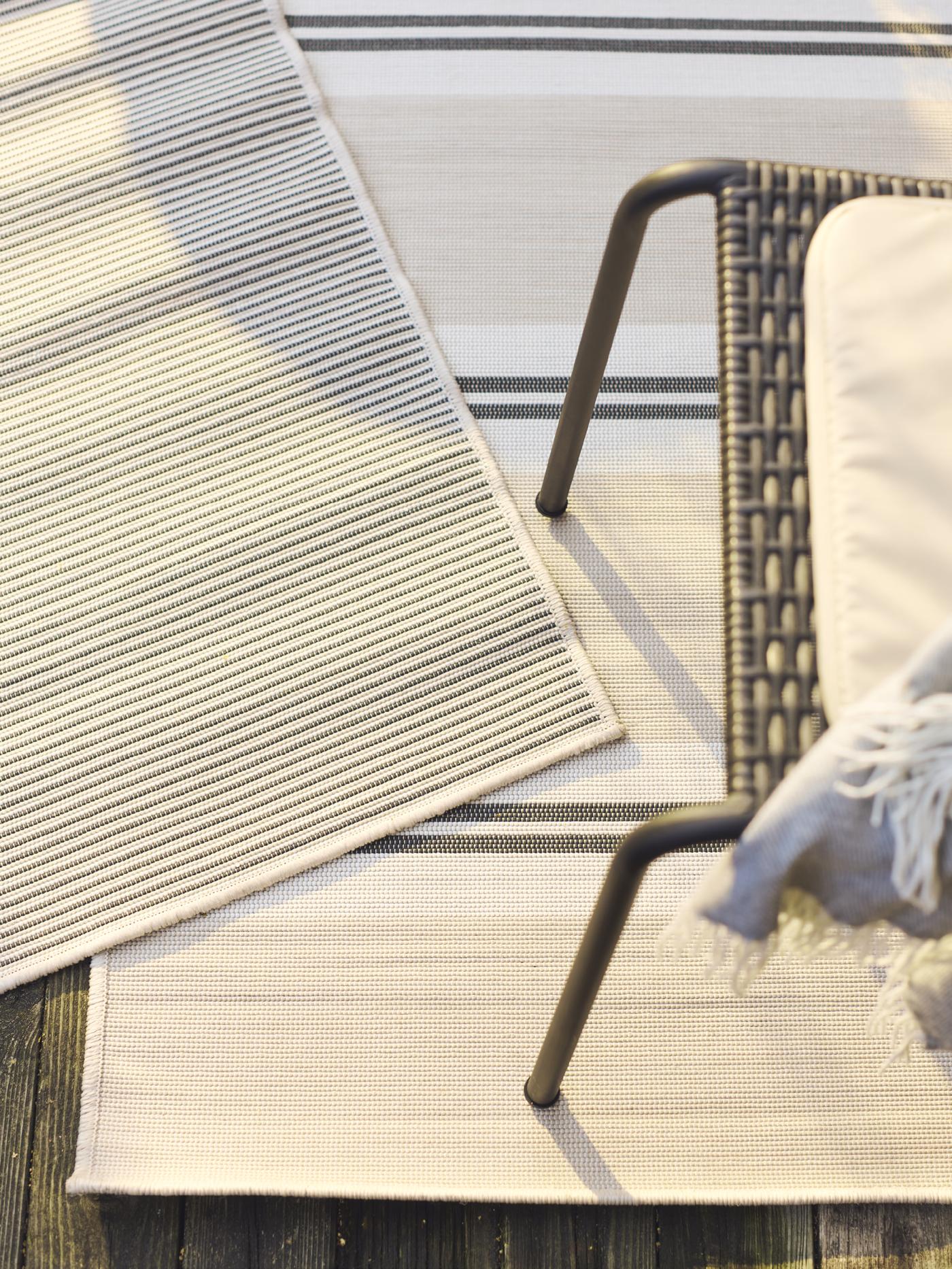 close up image of layered outdoor rugs