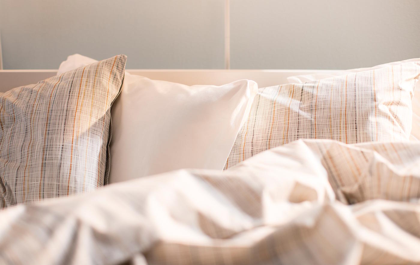 Close up of a soft bed in the morning light.