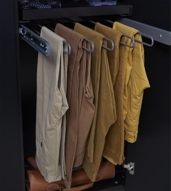 Clothes hangers like KOMPLEMENT pull-out trouser hanger from IKEA can collect your choices, so it’s easy to grab a pair and get on with getting ready. This dark grey-coated steel hanger has five arms and can hold 10-15 pairs of trousers.