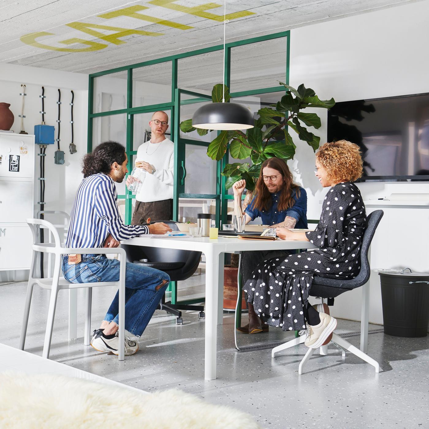 Co workers sat around a table