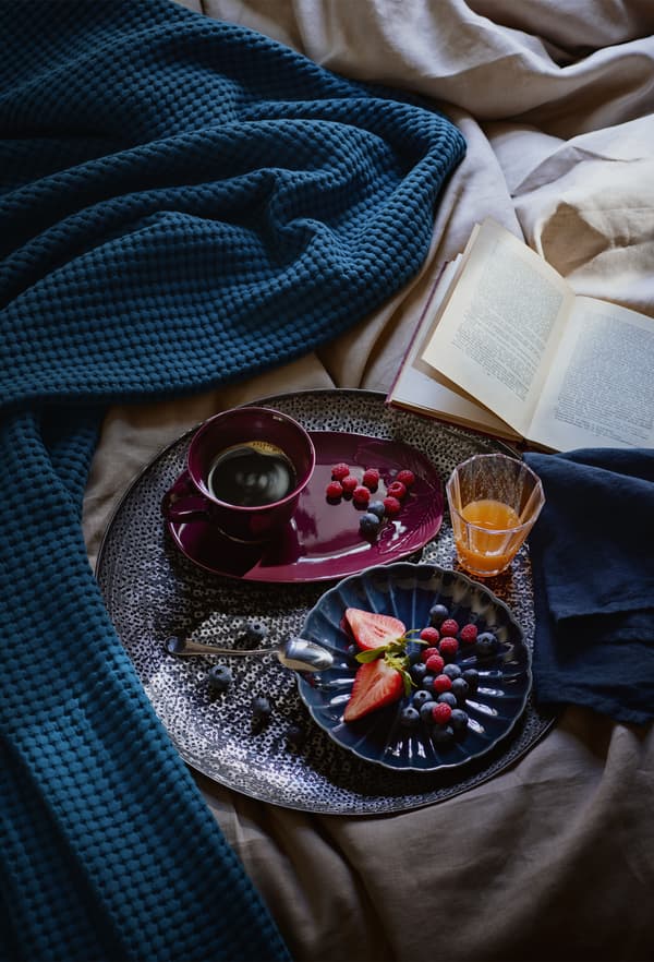 Coffee and breakfast in bed served on a tray.