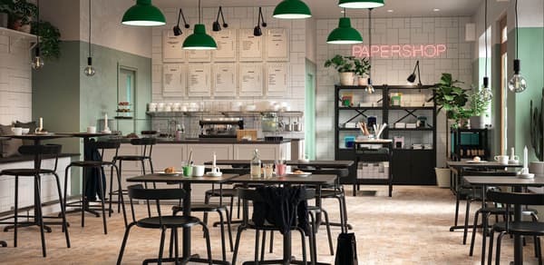 Coffee Shop with Black furniture, green lighting hardware, white cabinets, black bookcases 