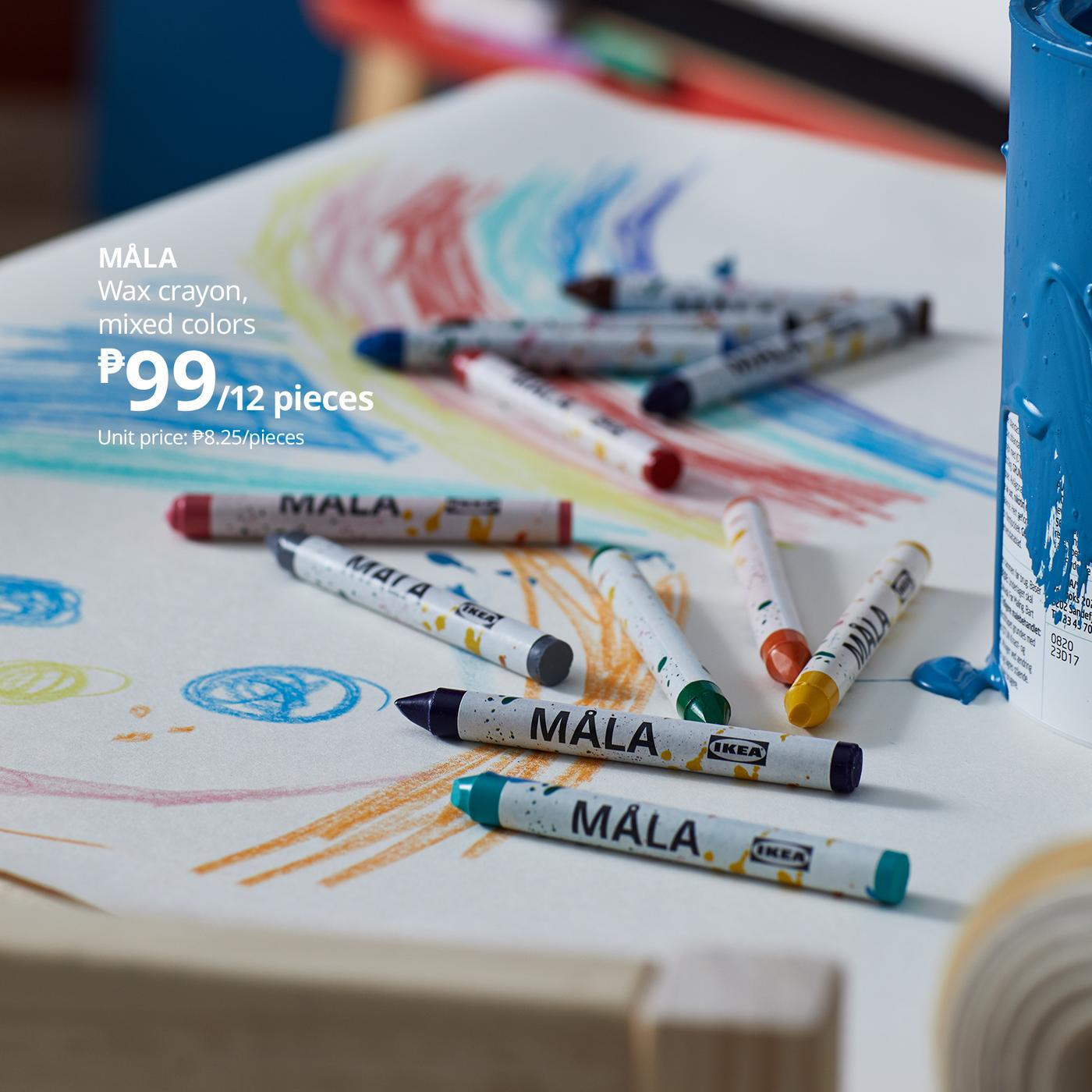 Colorful MÄLA wax crayons scattered over a child’s doodled paper, with a blue crayon tube nearby; product ad shows 12 pieces for ₱99.