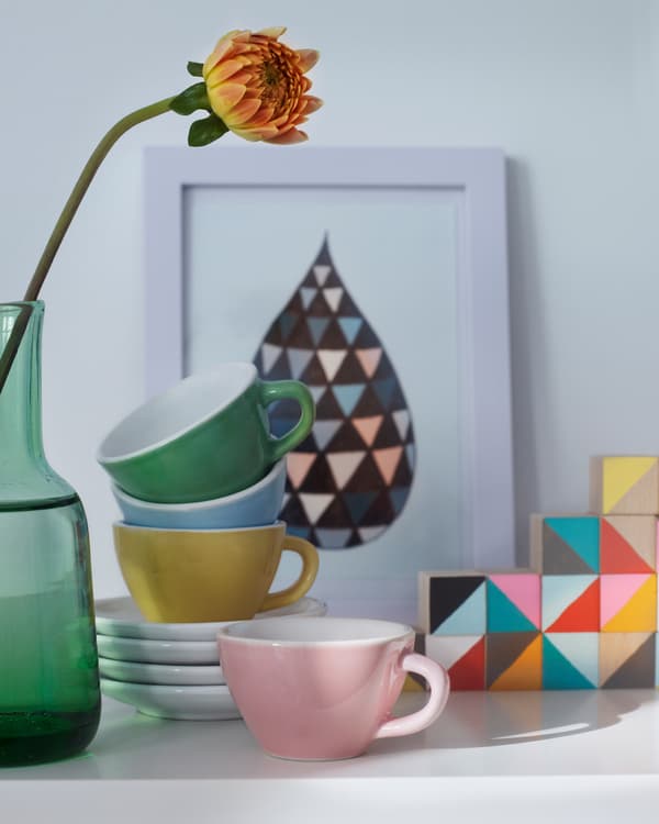 Colour themes help displays like this china, picture and flower collection feel cohesive.