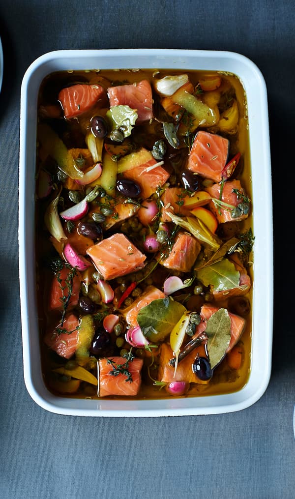 Confit salmon with fennel served in a white oven dish, seen from above.