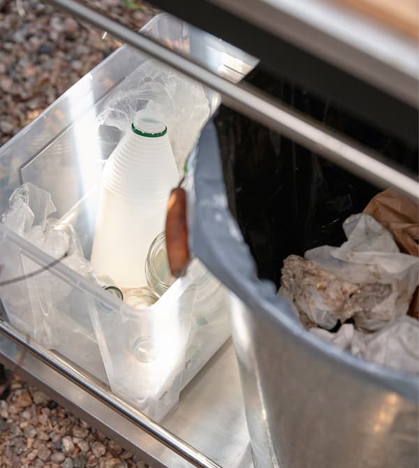 Containers for rubbish in an outdoor kitchen.