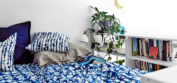 Cosy bed textiles with blue IKEA bedding