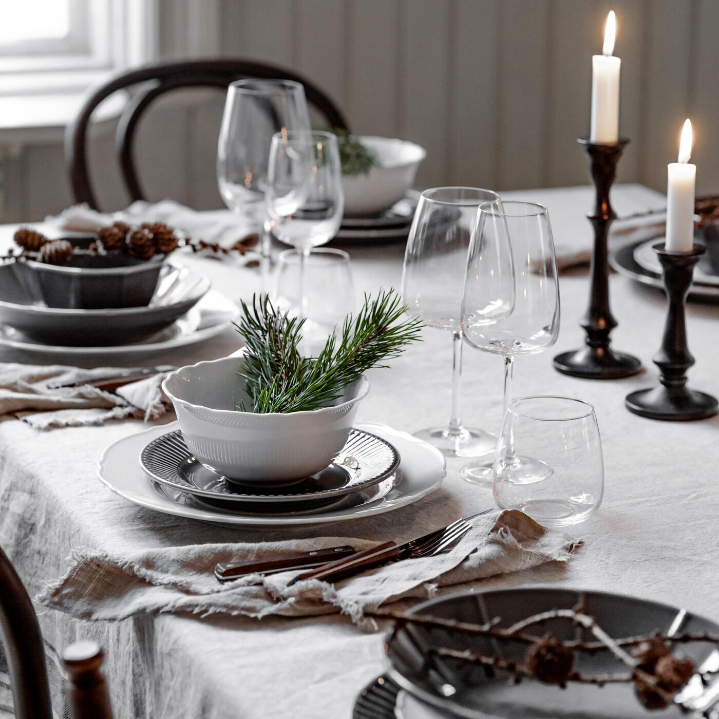 Country-style Christmas table with white and grey plates.