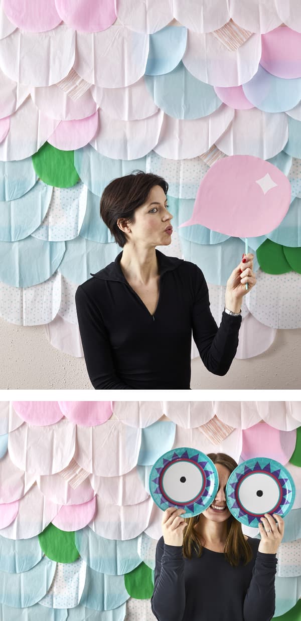 Create a fun photo booth by sticking colourful tissue paper to the wall or a board as a backdrop.