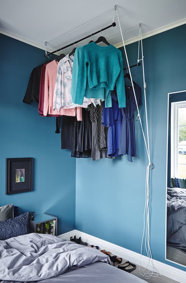 Create a raisable wardrobe that can be rolled up when not in use and down when you need to get dressed and undressed.