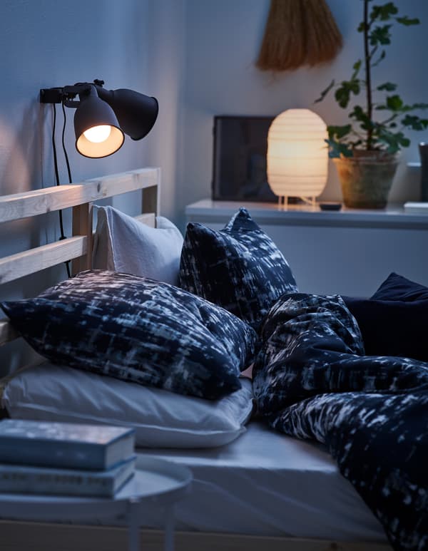 Create a soft, cosy atmosphere in your bedroom with a lamp that spreads a diffused and decorative light! IKEA offers a big selection of table lamps such as STORUMAN table lamp in white paper. Use an opal light bulb for an even distribution of light.