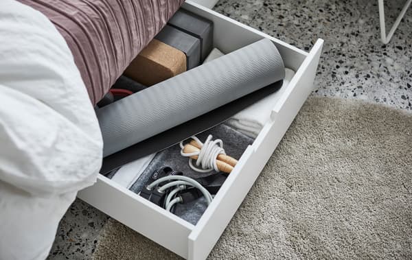 Create an nice and tidy area for an at-home workout right under your bed. IKEA NORDLI has plenty of space for yoga mats, jump ropes, bands, and more.