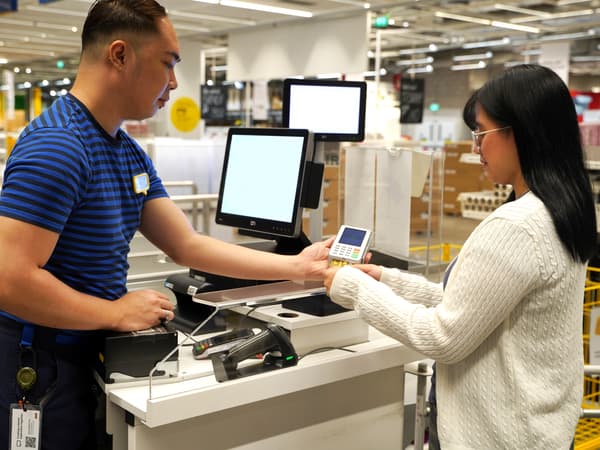 Customer in check out counter using card payment