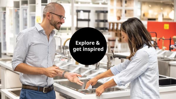 Customers choosing sinks and taps