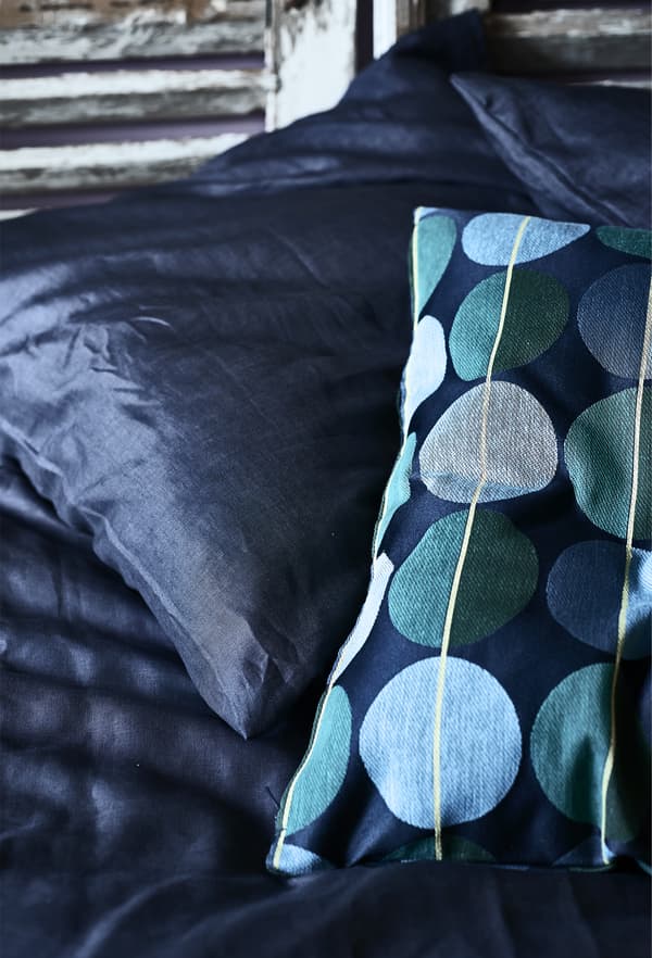 Dark blue and patterned cushions.
