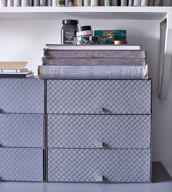 Desk organizsers sit on a shelf.