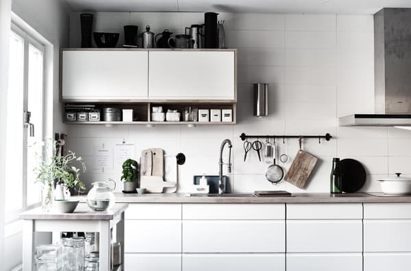 Displaying kitchen accessories makes the most of unused wall space.