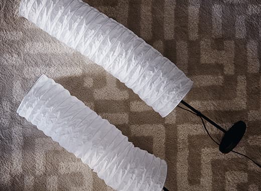 DIY light fixtures can be made from IKEA lamps you may already have at home like HOLMÖ floor lamp. Remove the tall rice paper shade and shape it so the ends meet. Tie and tape the ends together. Add an LED bulb and light cord.  