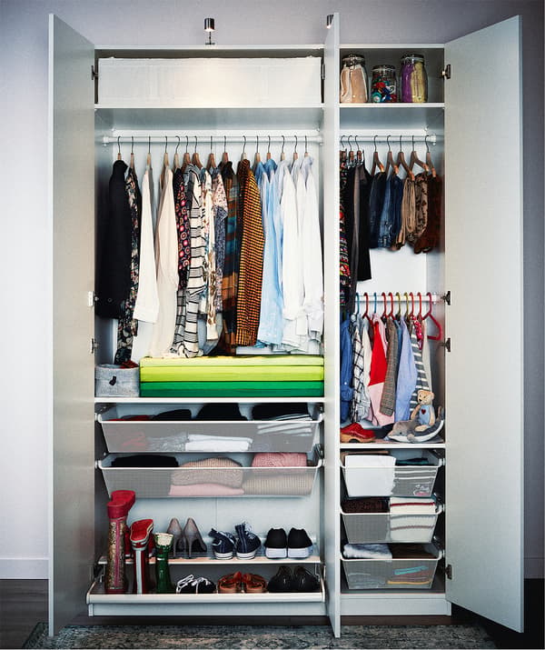Double-plus-single cupboard wardrobe packed with highly organized clothing on hangers and shelves, in drawers and boxes.