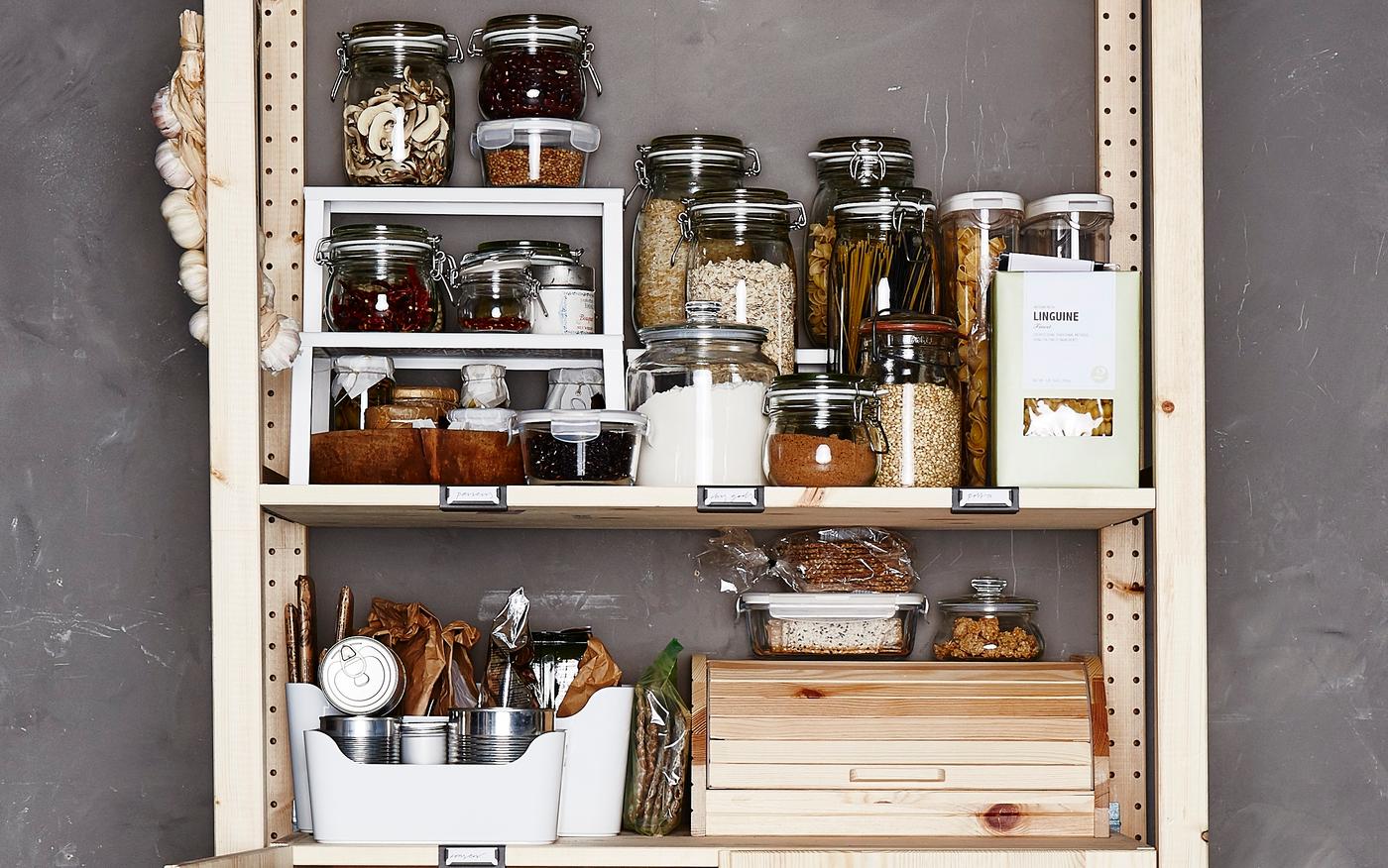 Dry goods are stored in glass jars.