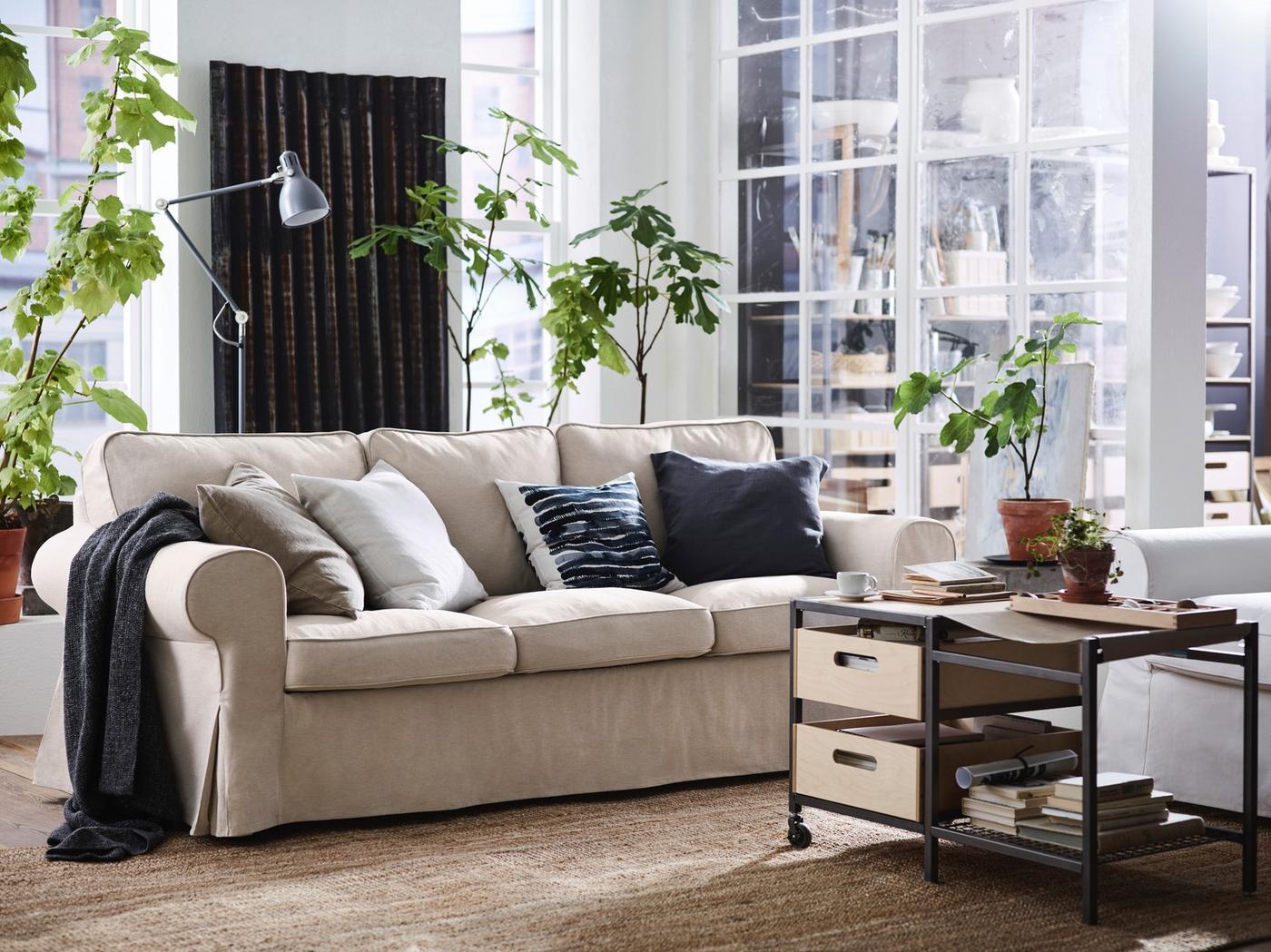 EKTORP sofa with cushions in an airy living room.