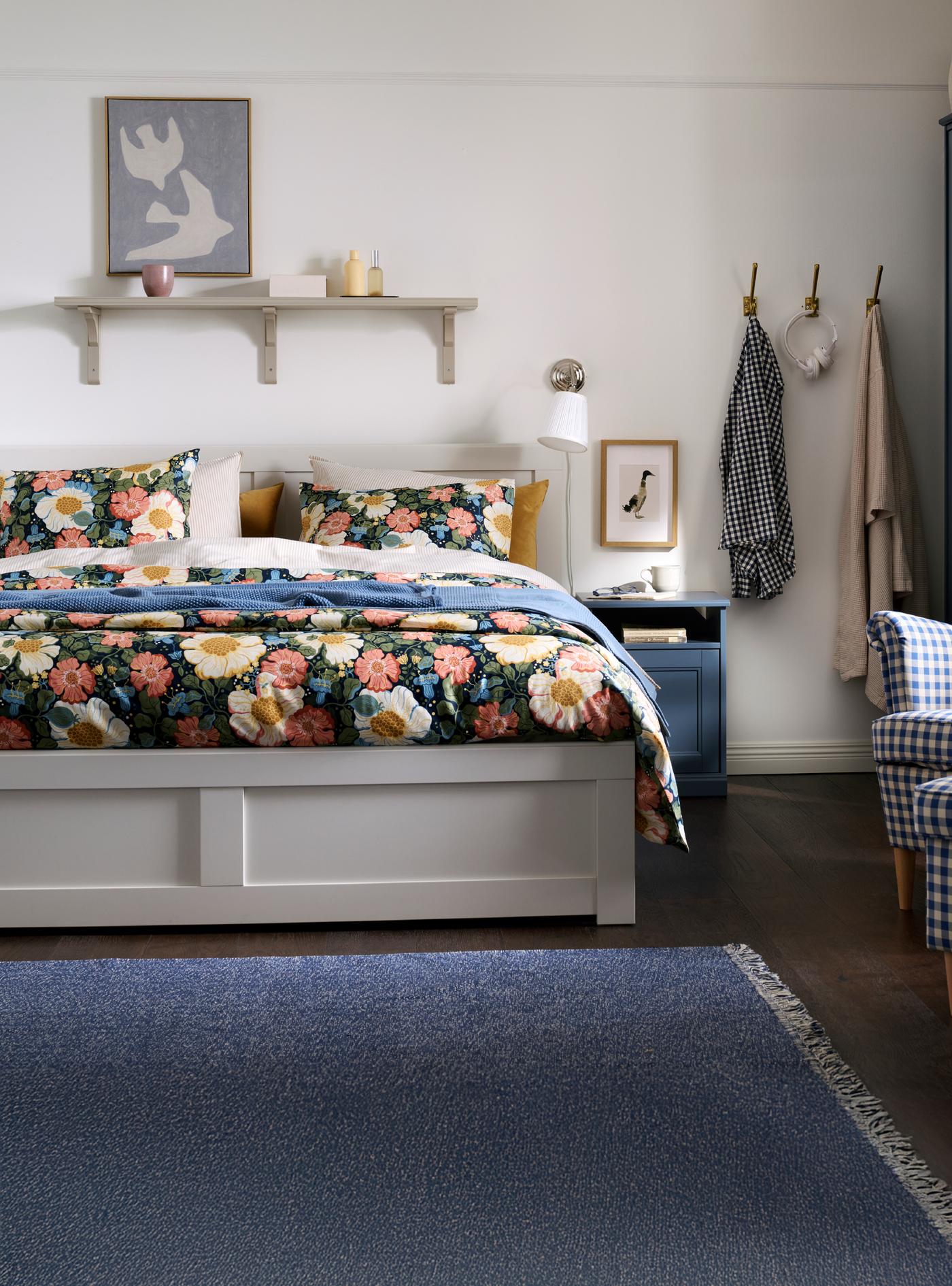 FÅGELFJÄLLET white bed frame in bedroom.