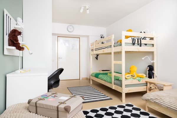 Family room after interior makeover with IKEA bunk bed, desk, and play area.