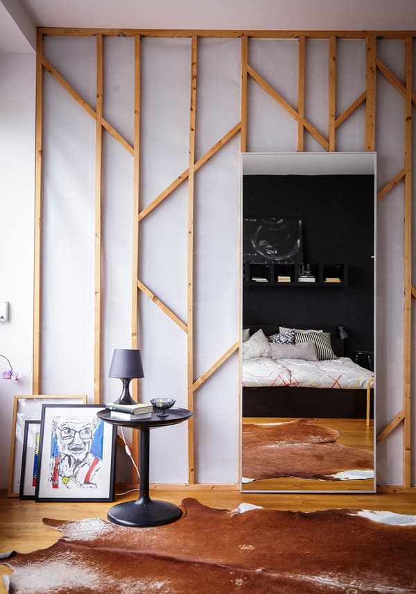 Fix a large mirror to the wall or back of a door to create the illusion of more light and space.