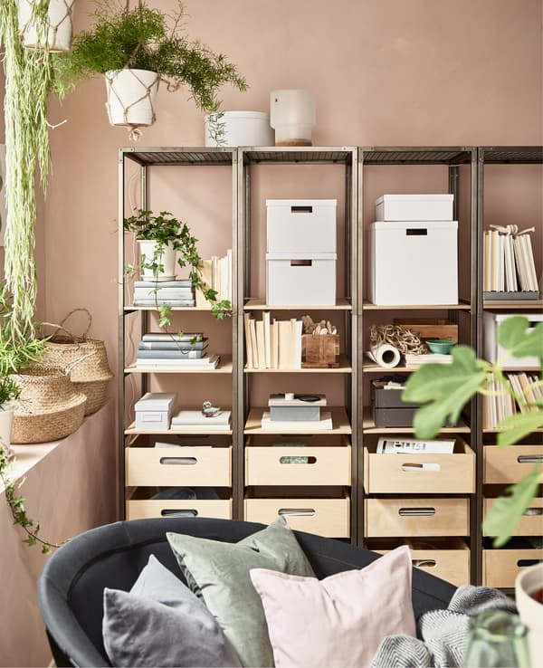 For peaceful home decor, consider open shelving units like side-by-side VEBERÖD shelf units in steel and birch from IKEA. The openness lets the wall colour shine through to calm the room. Use storage boxes to minimise clutter, too. 