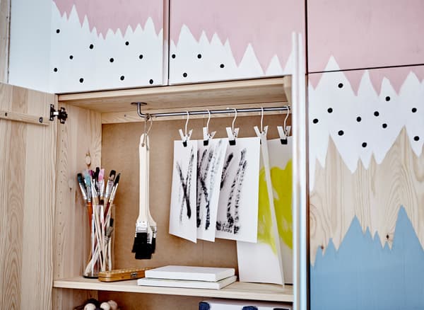 Four IVAR cabinets painted with an abstract pattern and grouped together to make a big impact with lots of storage