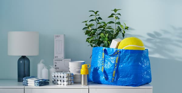 FRAKTA bag and products on top of a cabinet
