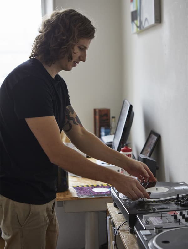 Frederik playing records in his bedroom.