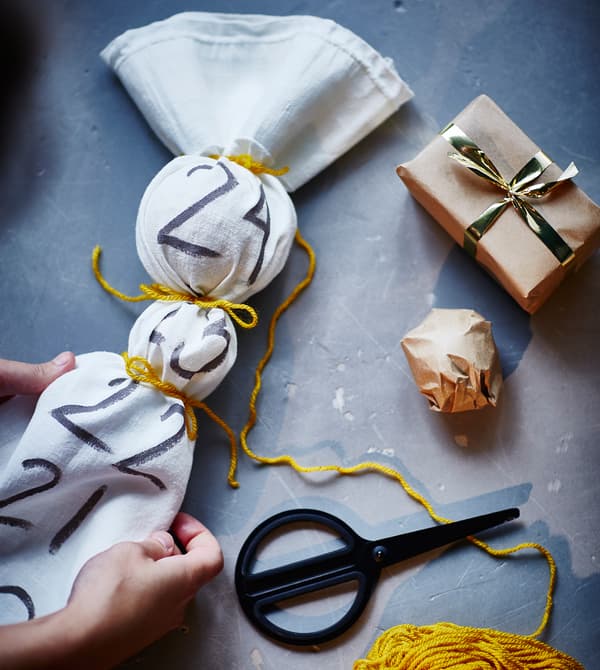 Gifts are placed inside a fabric advent calendar.