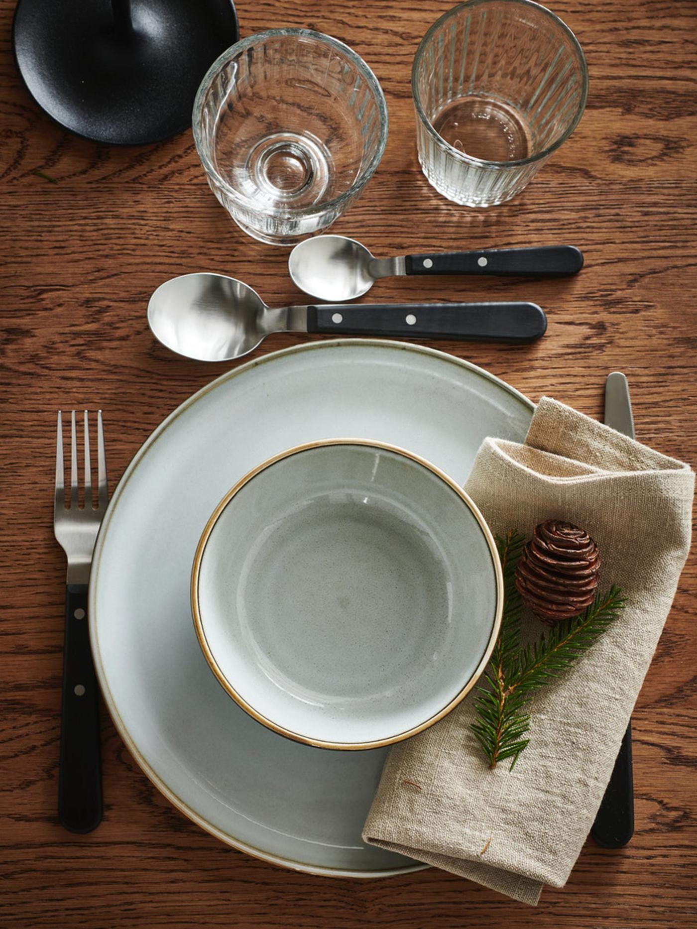 GLADELIG plates set on a table.
