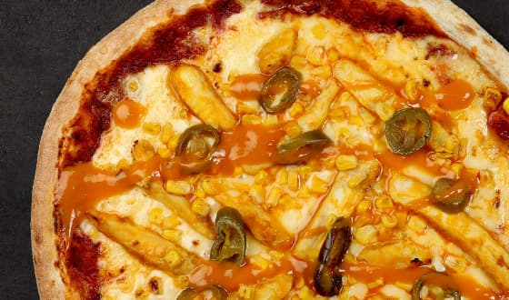 Golden BBQ Chicken Pizza topped with chicken fillet in South Carolina Gold barbecue sauce, sweetcorn, jalapeños and cheese on a tomato sauce base