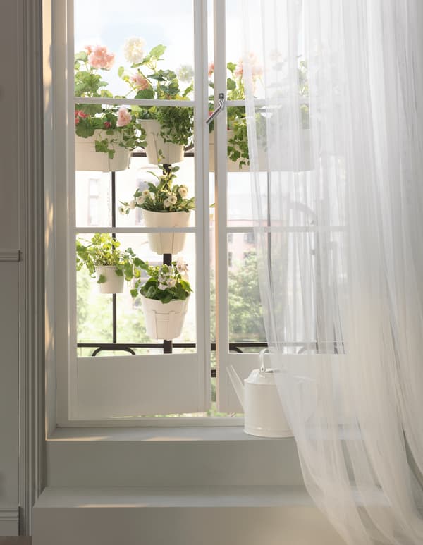 Got garden dreams but only a small apartment? Try extending your windowsill using rails or a balcony outside.