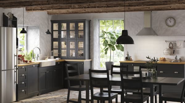 Grey kitchen with a black table and six chairs