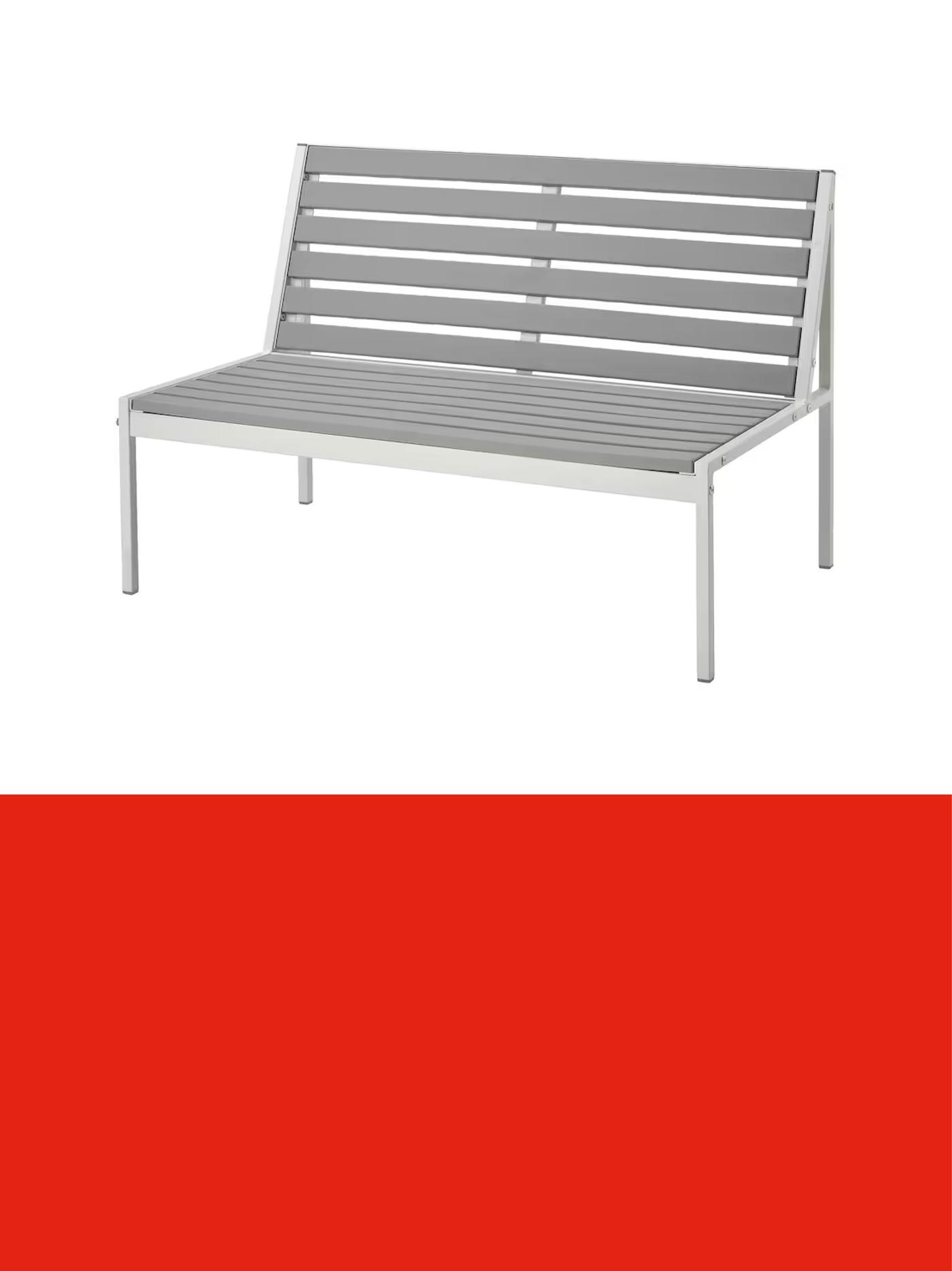 Grey outdoor bench with a slatted seat and backrest, shown against a light background above a red promotional banner.