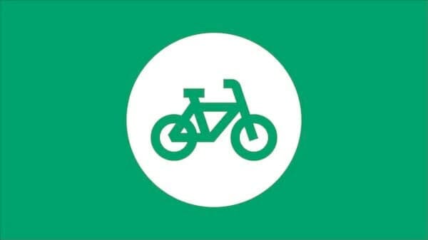 Groene achtergrond met witte cirkel met het icoon van een fiets