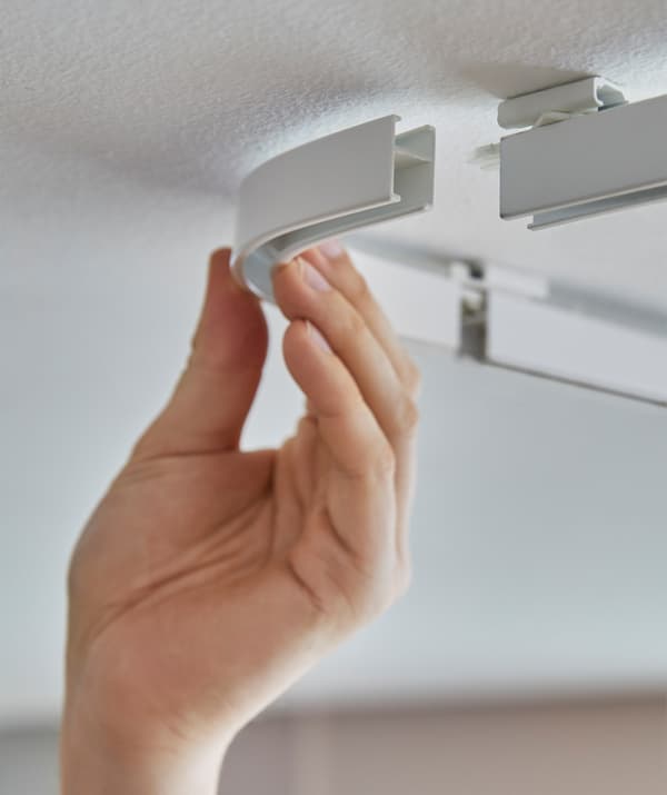 Hanging curtains from the ceiling is easier with VIDGA tracks from IKEA. Each mount needs only one screw and the rest clicks together. VIDGA glider/hook in white comes in a 24-pack and rolls in, so you can quickly attach or swap curtains.