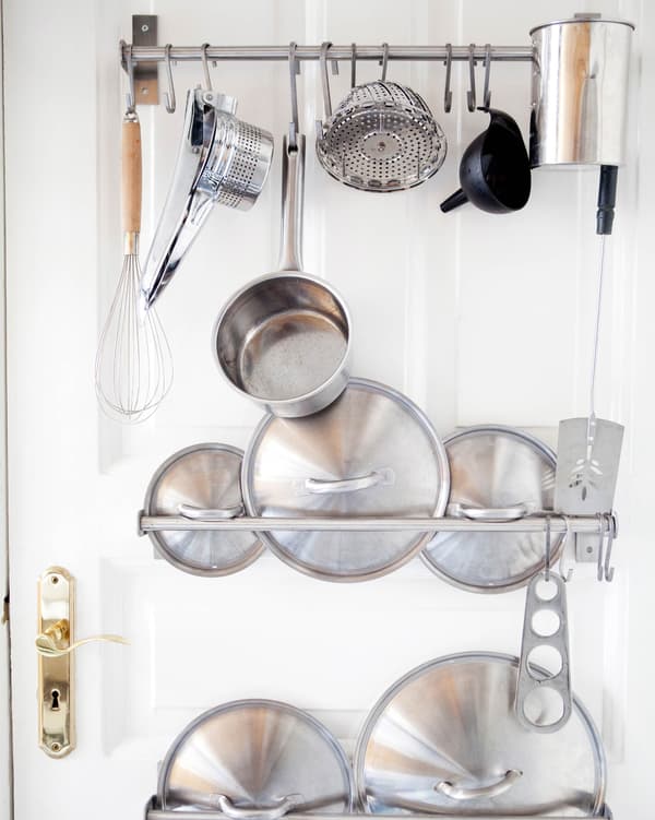 Hanging pots and pans on GRUNDTAL rails makes for a functional and fun storage solution.